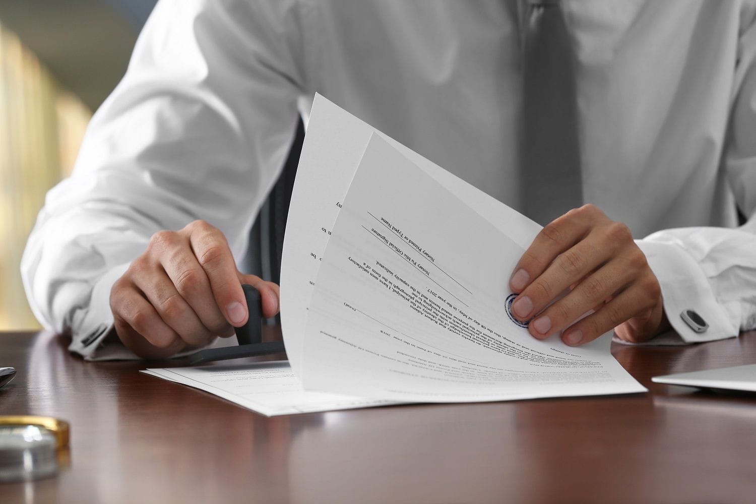 A solicitor stamps and verifies a legal document