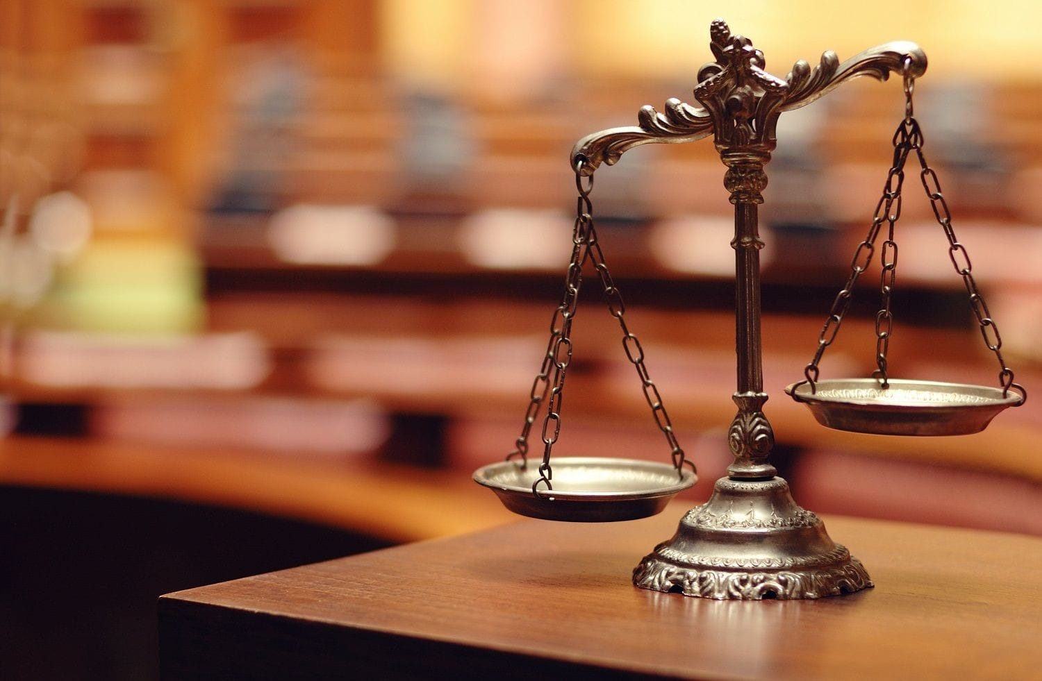 Silver scales of Justice on a desk